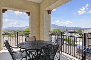 Balcony with black metal table and chairs