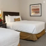 Two-queen bedroom in a condo suite for family vacations at Canoa Ranch Golf Resort