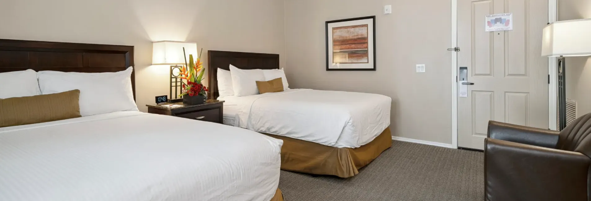 Two-queen bedroom in a condo suite for family vacations at Canoa Ranch Golf Resort