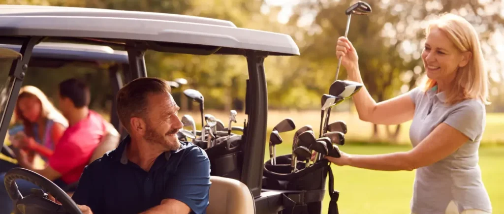 Couple enjoying a golf cart round together, part of a golf and spa experience for couples in Arizona