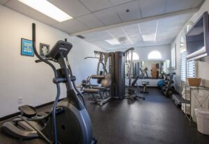 Fitness center room with exercise equipments