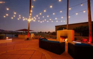 Outdoor space with sofa near fire place